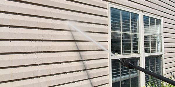 Soft pressure washing home exterior